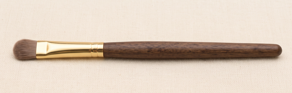 Flat, densely packed eyeshadow shader brush for packing color onto the lid
