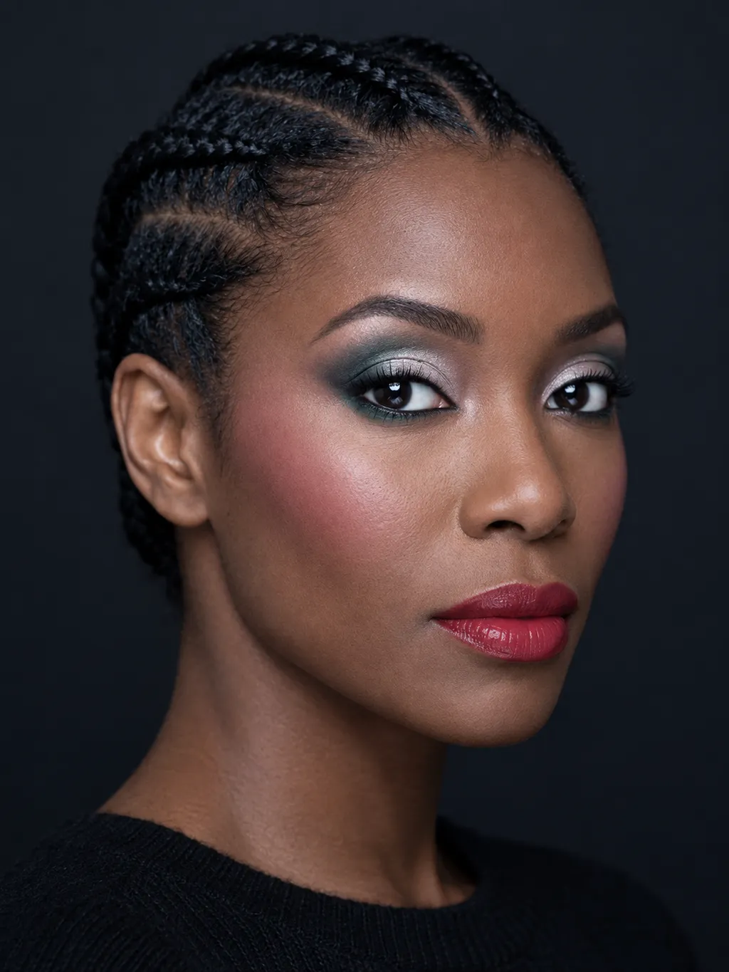 Cold-pine green crease with a sheet of icy-silver across a pewter lid and a bright-cranberry lip on True Winter coloring