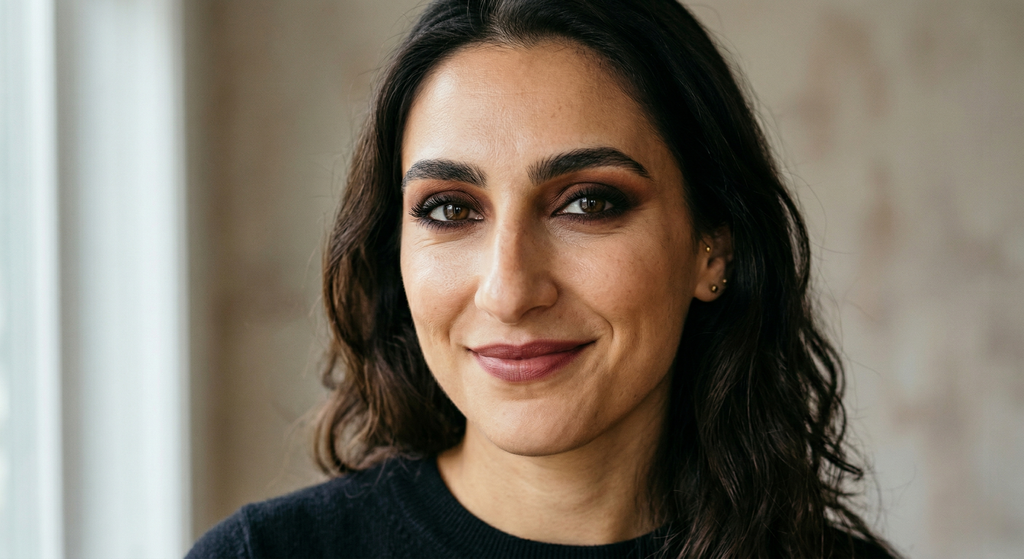 Bold smoky eye makeup paired with a soft nude lip