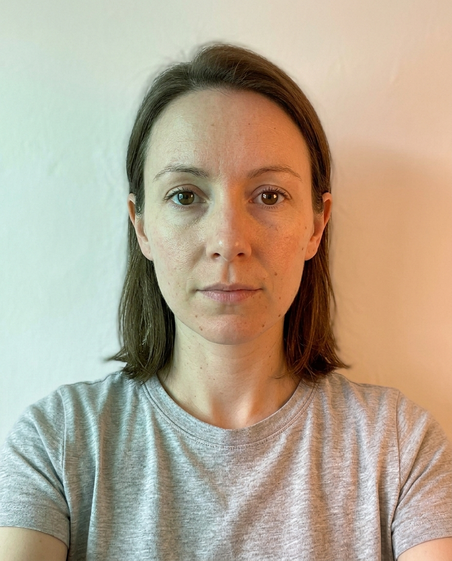 Selfie taken under warm tungsten lighting showing an orange-yellow color cast on skin
