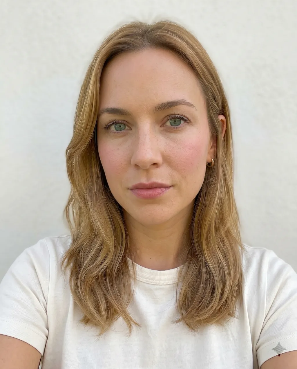 Selfie with visible foundation and concealer altering natural skin tone