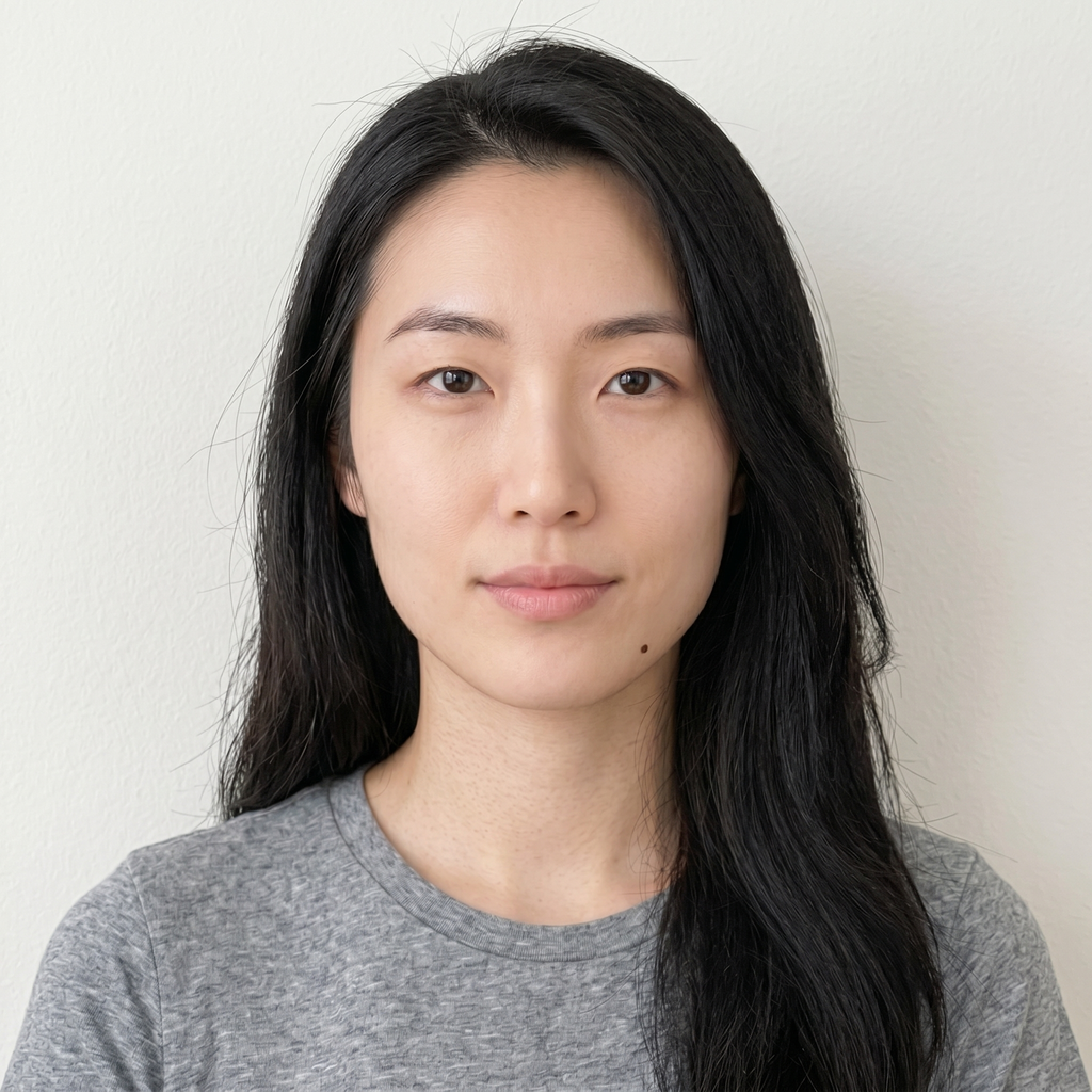 Straight-on selfie at eye level with relaxed expression and even lighting on both sides