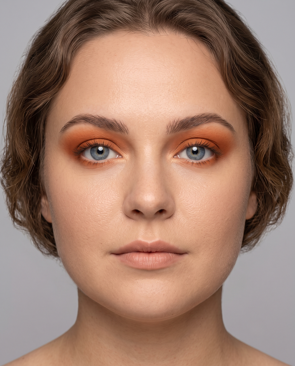 Soft Autumn coloring with blue eyes wearing the same rust eyeshadow pushed toward its hazier, dustier end