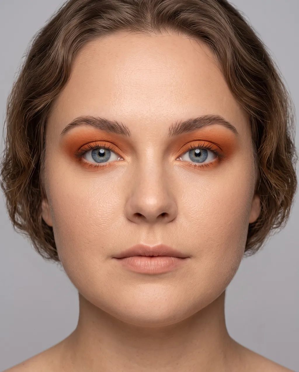 Soft Autumn coloring with blue eyes wearing the same rust eyeshadow pushed toward its hazier, dustier end